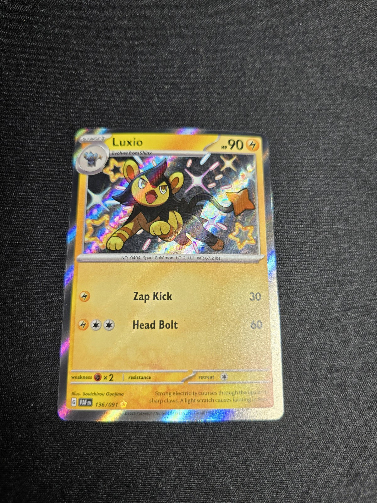 Pokemon TCG Card Paldean Fates Shiny Luxio 136/091 NM 2024